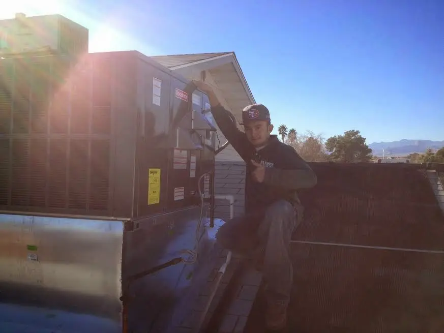 HVAC technician performing HVAC Inspection on a rooftop unit in Los Altos Hills
